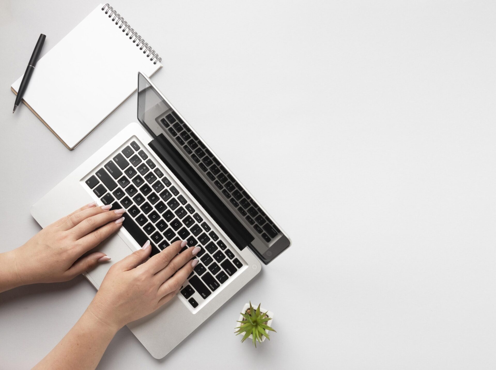 Laptop on Table & Hand Photo